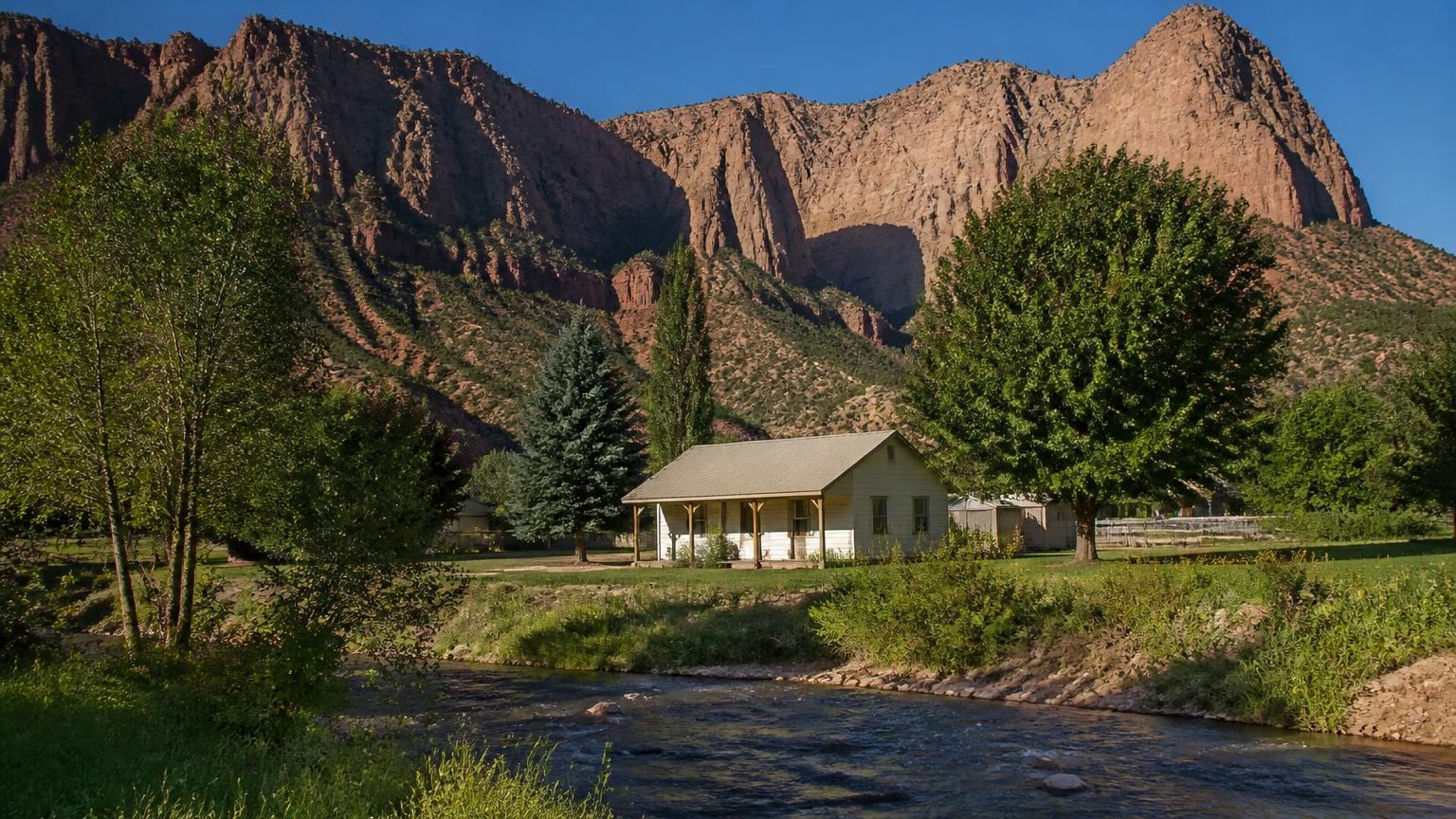 Homeowners insurance in Kanarraville, Utah (84742) — a village home beside Kanarra Creek in Kanarraville, Utah below the Kolob cliffs