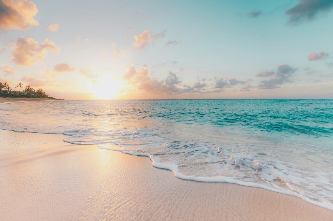 Sunrise over a tranquil turquoise beach — life insurance peace of mind in St. George, Utah