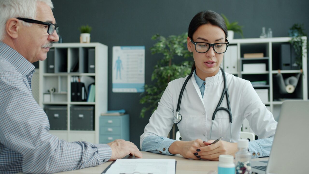 Doctor reviewing a Medicare plan with a senior patient — Medicare coverage in St. George, Utah