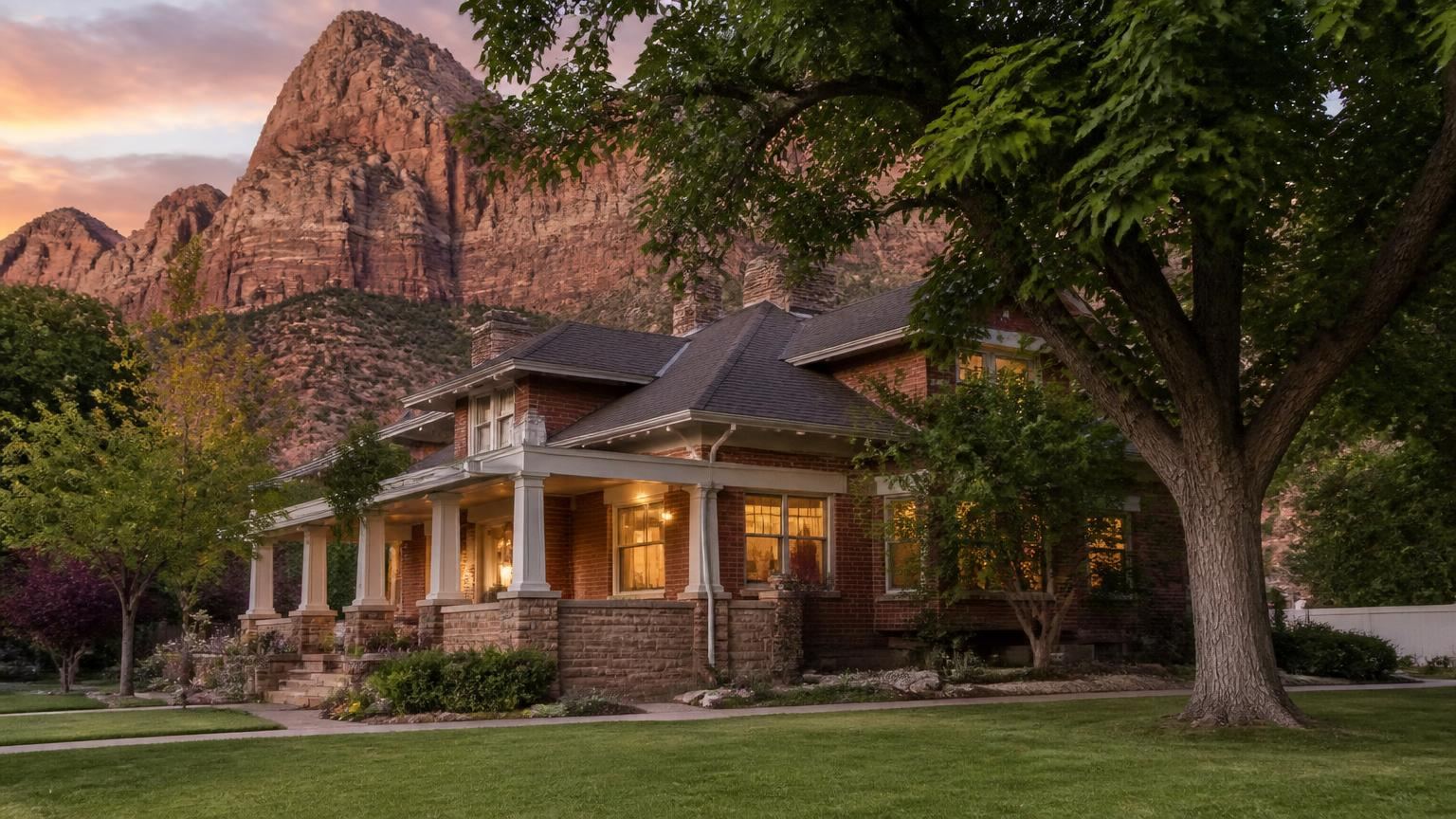 Homeowners insurance in Rockville, Utah (84763) — a historic brick home in Rockville, Utah beneath towering red sandstone cliffs near Zion