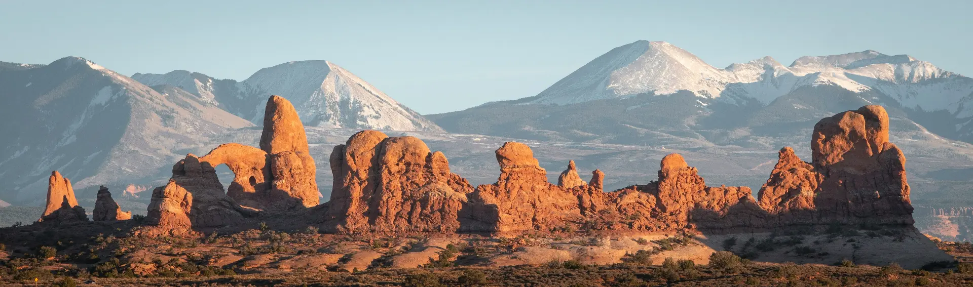 Red rock formations and snow-capped mountains in Southern Utah