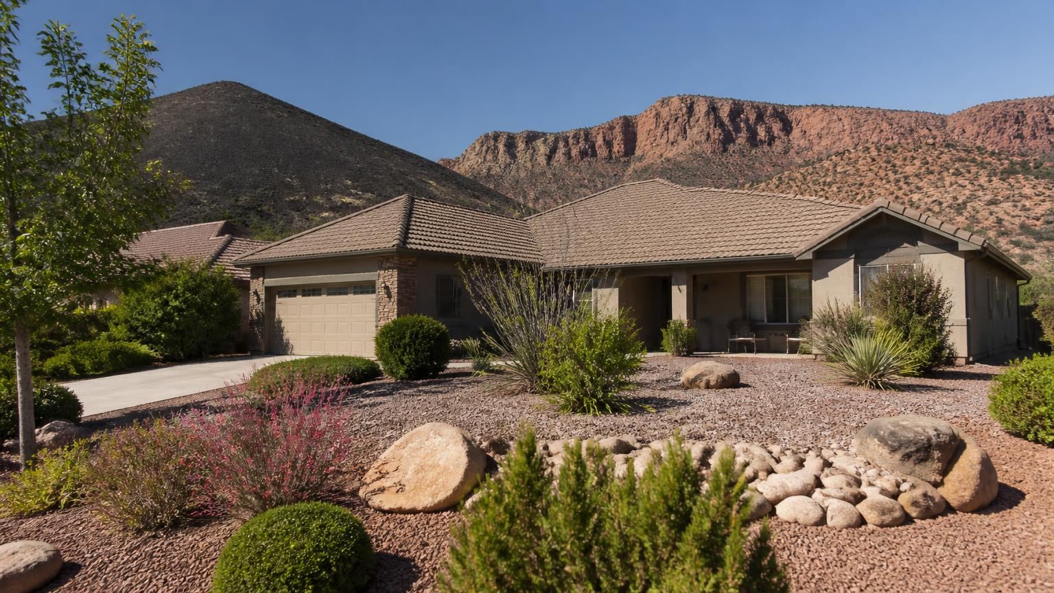 Homeowners insurance in Veyo, Utah (84782) — a ranch-style home near the Veyo volcano and red cliffs of State Route 18 in Veyo, Utah